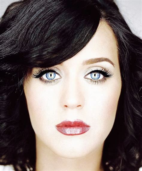 A Woman With Dark Hair And Blue Eyes