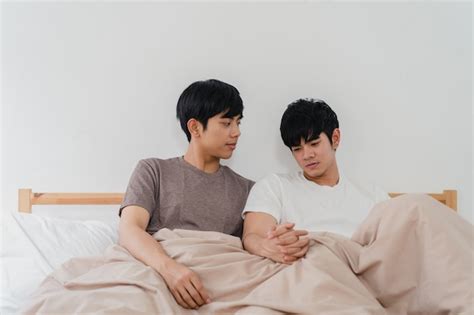 Free Photo Handsome Asian Gay Couple Talking On Bed At Home Young