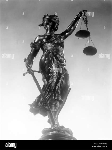 Statue Of Justice Sword And Scales Black And White Stock Photos