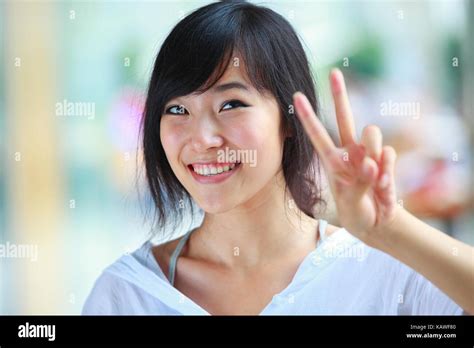 Picture Of One Young Pretty Asian Woman Smile At Camera Stock Photo Alamy