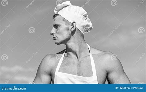 Man On Confident Face Wears Cooking Hat And Apron Sky On Background Cook Or Chef With Muscular