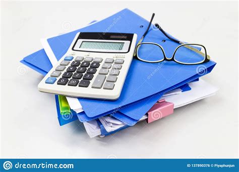 Blue File Folder With Paper Glasses Calculation On The Table Stock