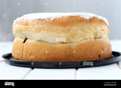 Boston Bun With Coconut Icing On White Timber Stock Photo Alamy