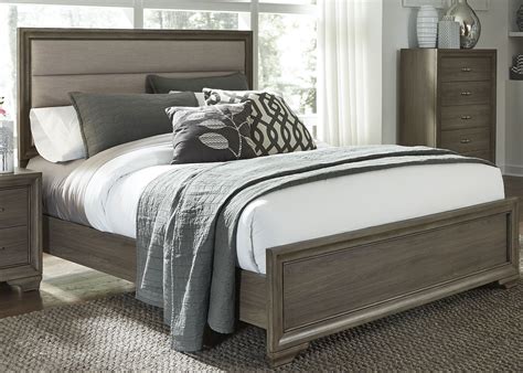 With a warm and beautiful distressed finish, this bedroom group is sure to sooth you. Hartly Gray Wash Upholstered Panel Bedroom Set from ...