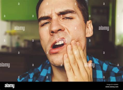 Toothache Suffering Young Man With Teeth Problems The Guy Holds The