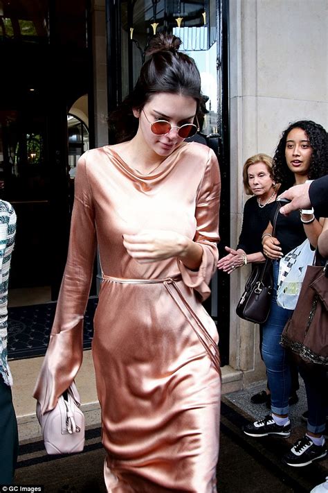 kendall jenner flashes her nipple piercing in satin gown as she goes makeup free in paris sm06