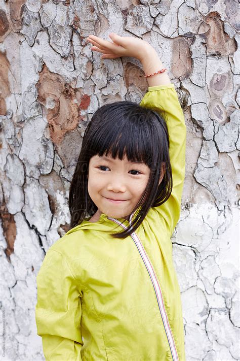 Asian Little Girl Stroking The Ancient Big Tree Travel In Hanoi By