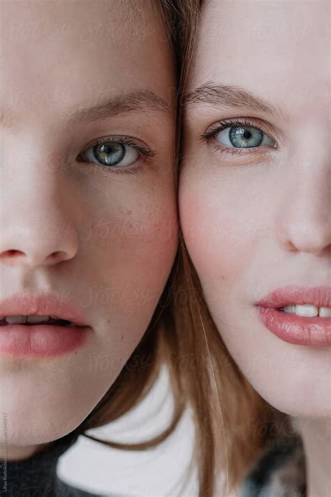 Closeup Beauty Portrait Of Two Half Faces Of Pretty Young Models By
