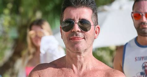 simon cowell shows off buff body in barbados amidst america s got talent drama mirror online