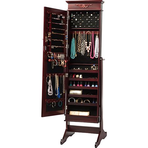 The jewelry armoire features double doors, left door providing pictures display frame while the mirrored right door revealing a. Bimini Free Standing Mirror Jewelry Armoire - Brown | DCG ...