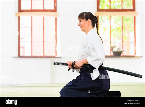 Woman At Aikido Martial Arts With Sword Stock Photo Alamy