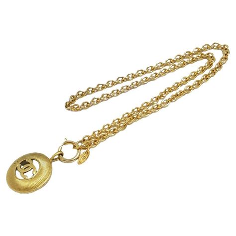 Chanel Gold Tone Metal Cc Logo Cutout Sunburst Pendant Necklace For