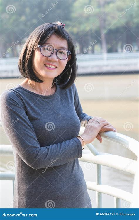 Portrait Of 40s Years Asian Woman With Happiness Toothy Smiling Stock