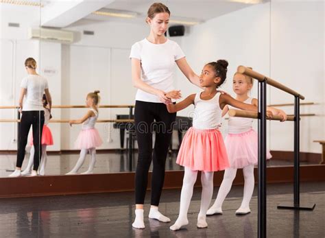 Teacher Helping Her Little Ballerinas Stock Photo Image Of Barre