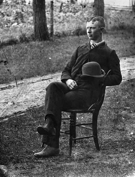 1890s 1900s Side View Of Man Wearing Suit Seated On Chair Outside