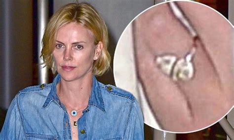 charlize theron meets sean penn in south africa as she flashes engagement ring daily mail online