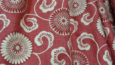 CURTAINS, a pair, red patterned fabric, lined and interlined, each ...