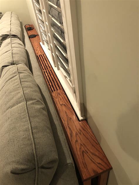 If you're debating between an over the couch table or behind the couch table, this funky but functional will sell you on the latter. Made a sofa table to help vent the radiator behind the ...