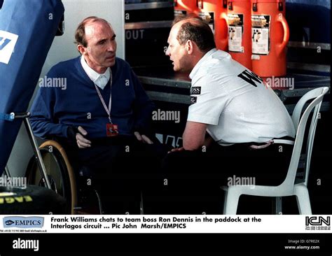 Frank Williams Chats To Team Boss Ron Dennis In The Paddock At The