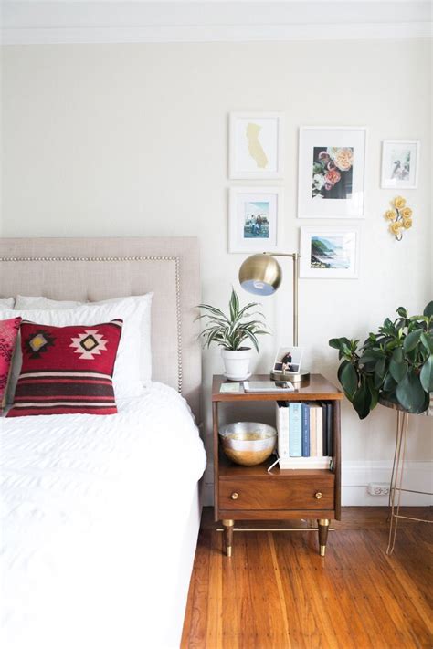 Positioning of floor rug under bed. How One Couple Made Their 700-Square-Foot Apartment Feel ...