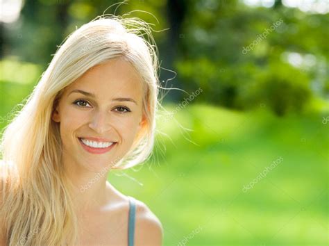 Smiling Young Beautiful Woman Outdoors — Stock Photo © Gstudio 11476725