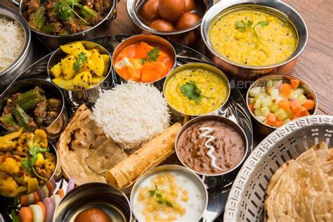 List of protein rich vegetarian indian foods. Indian assorted vegetarian food in plate and serving bowls ...