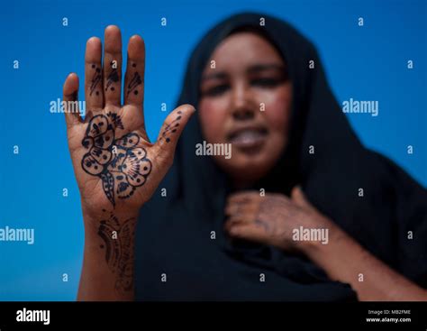 A Somali Woman Showing Her Hand Painted With Henna North Western