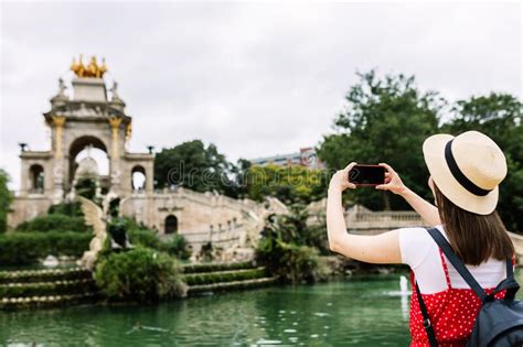 Beautiful Young Woman Tourist Wearing Hat Taking Photos During Summer
