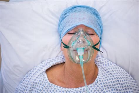 Patient Wearing Oxygen Mask Lying On Hospital Bed Stock Photo Image