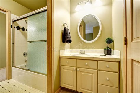 What are the shipping options for yellow bathroom vanities? Bathroom Interior In Yellow Tones With Vanity Cabinet ...
