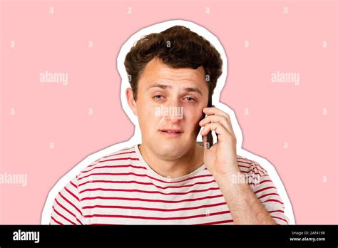 A Young Man Heard The Bad News On The Phone And Begins To Cry Emotional Man Isolated On White