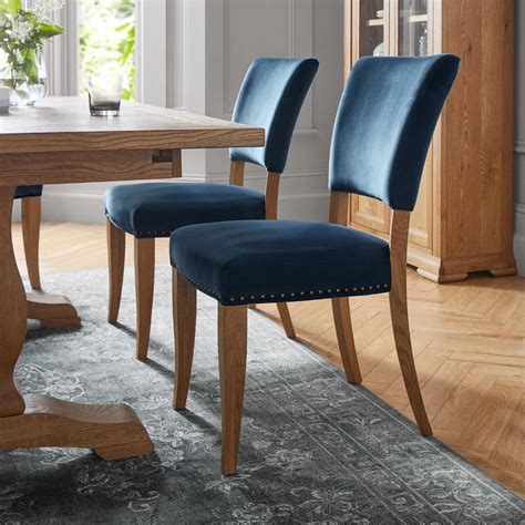Rustic Oak Wood And Dark Blue Velvet Fabric Upholstered Dining Room