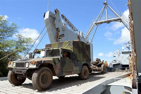 A Humvee Towing A M777a2 155mm Howitzer Assigned To Nara And Dvids