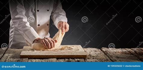 Hands Of A Male Chef Cook Or Baker Kneading Dough Stock Photo Image