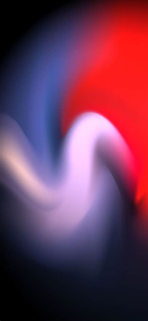 Blurry Image Of Red And White Swirls On Black Background