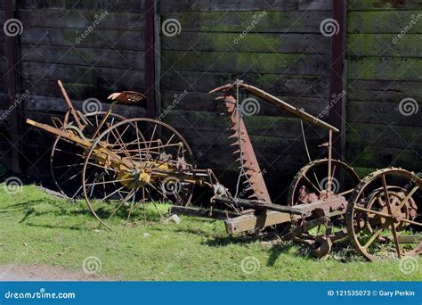 Vintage Rusty Old Farm Equipment Lying Unused On A Grass Verge Stock