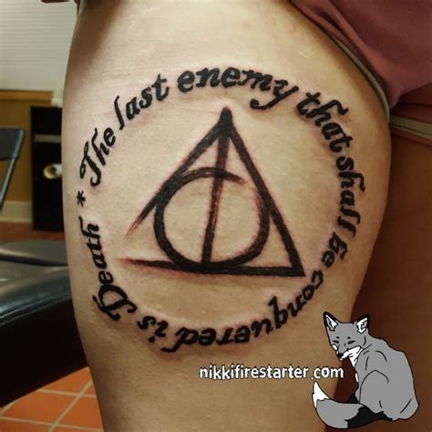 tattoo uploaded by nik firestarter deathly hallows on the thigh