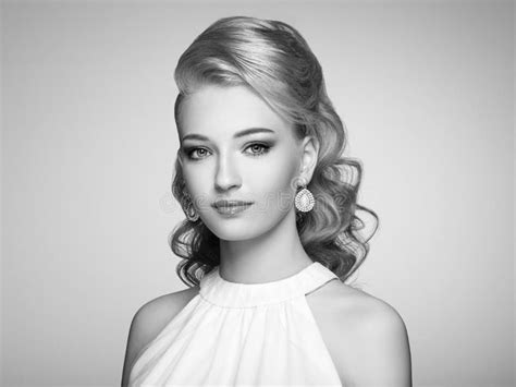 Fashion Portrait Of Young Beautiful Woman With Elegant Hairstyle Stock