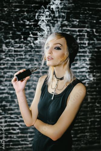 Sexy Goth Girl Smokes Electronic Cigarette On Dark Background The Model Vaper Vaping A