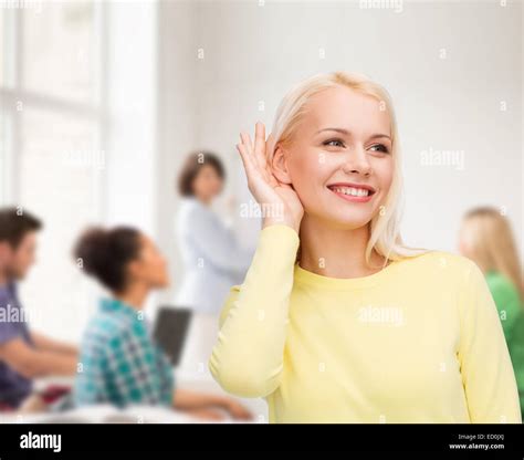 Smiling Young Woman Listening To Gossip Stock Photo Alamy