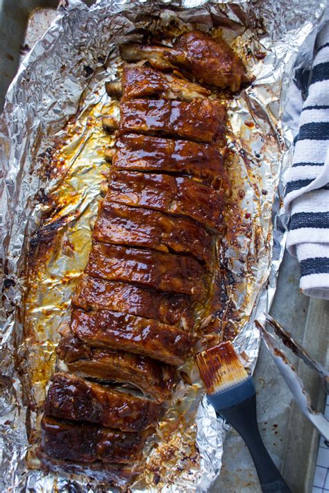 Set the meat on a rack set into a roasting pan. Easy Oven Baked Ribs | Recipe | Pork back ribs oven, Oven ...