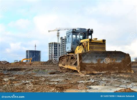 Bulldozer During Of Large Construction Jobs At Building Site Land
