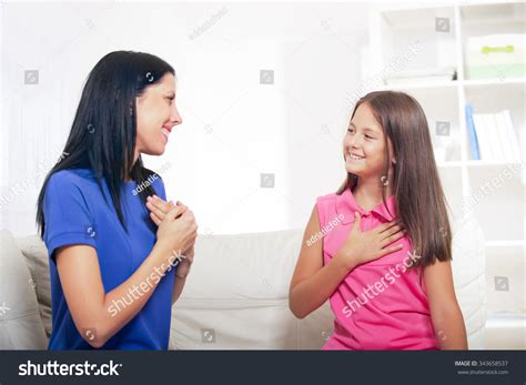 Smiling Deaf Girl Learning Sign Language Foto Stock 343658537