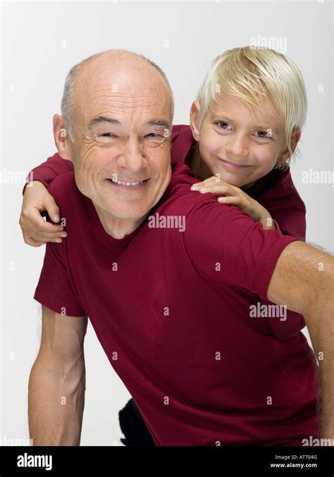 Grandson 8 9 Embracing Grandfather Smiling Portrait Stock Photo Alamy