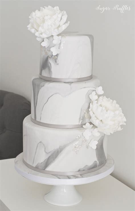 Grey Marble Wedding Cake | Charlotte | Flickr Black and white and gold champagne wedding reception centerpiece centerpieces candle modern candelabra candleabra candles holder holders rock a black marble cakewith gold decor and sugar or real blooms, go for a matte black cake with gold pattern decor, add white touches if you think that.