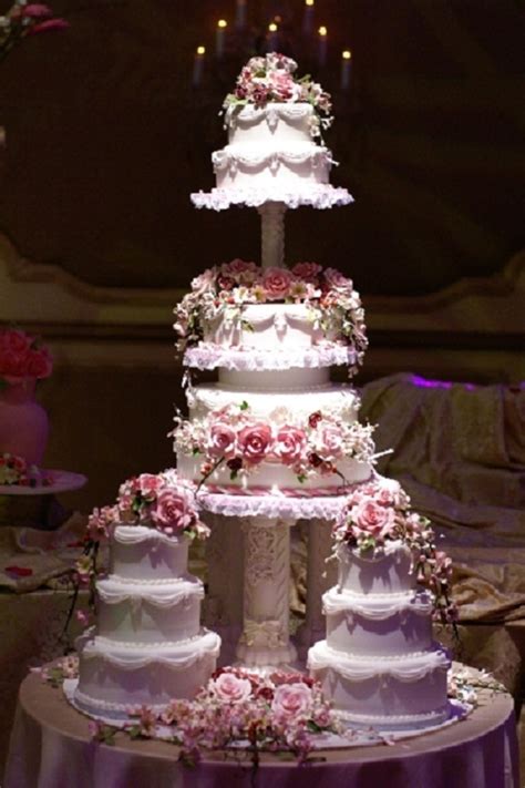 Cut each cake in half so each tier has four layers. Multiple Tiered Wedding Cake - CakeCentral.com