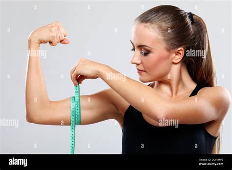 Beautiful Girl Measure Her Biceps With A Ruler Stock Photo Alamy