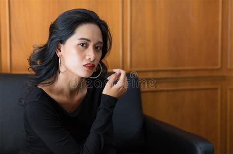 Woman Sitting Her Hand Under Her Chin Stock Photos Free And Royalty