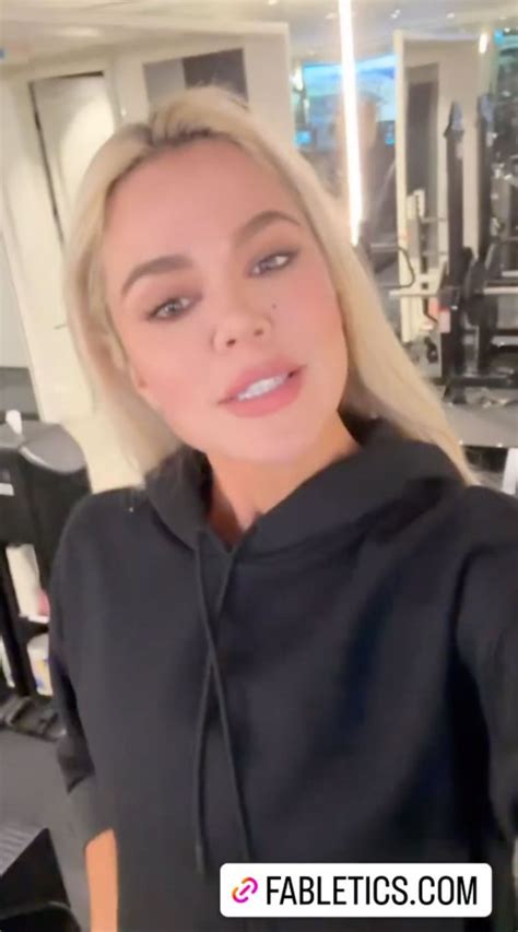 Khloe Kardashian Lifts Her Shirt To Show Off Her Tiny Waist And Shrinking Butt In Skintight