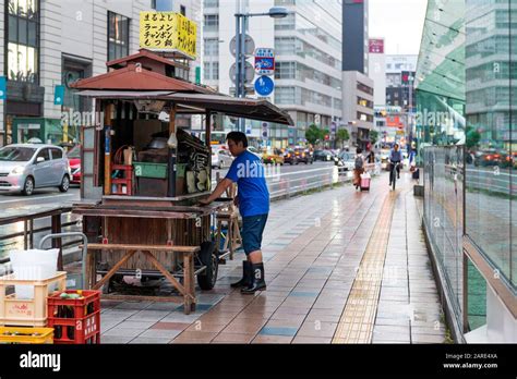 fukuoka japan 27 may 2019 street food seller preparing his food stall in tenjin district